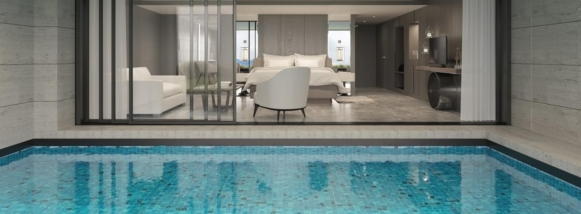 A corner of a room with an indoor pool